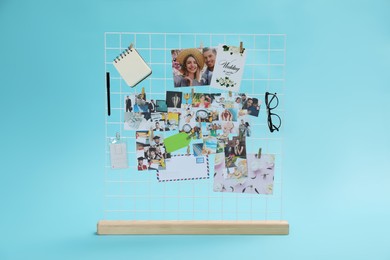 Vision board with different photos and other elements representing dreams on turquoise background