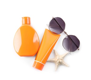 Photo of Sun protection products, sunglasses and starfish on white background, top view. Beach objects