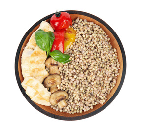 Tasty buckwheat porridge with meat and mushrooms isolated on white, top view