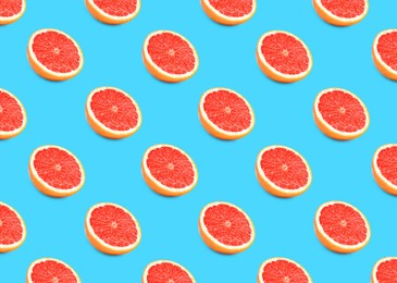 Many fresh ripe grapefruits on turquoise background. Seamless pattern design