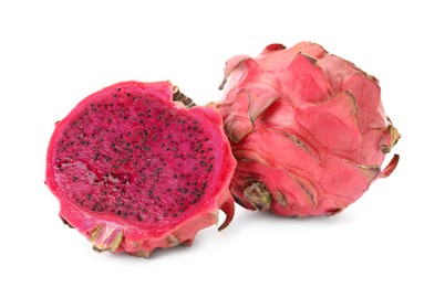 Photo of Delicious cut and whole red pitahaya fruits on white background