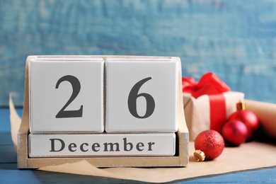 Wooden block calendar and decor on table. Christmas countdown