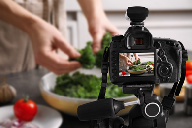 Food photography. Shooting of woman making salad with broccoli, focus on camera