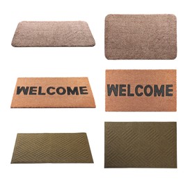 Set with different door mats on white background
