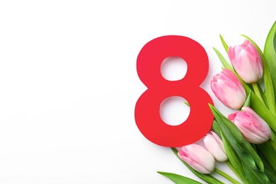 8 March greeting card design with tulips on white background, top view. Space for text