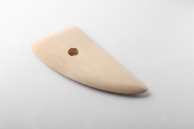 Wooden rib for clay modeling on white background