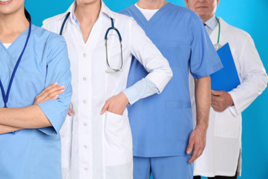 Group of doctors on blue background, closeup view