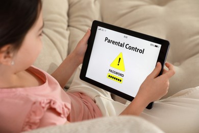 Little girl having access restriction by parental control on tablet, closeup. Child safety