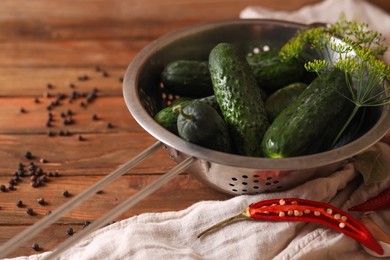 Fresh cucumbers, dill, garlic and pepper on wooden table. Pickling recipe