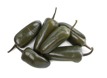 Photo of Pickled green jalapeno peppers on white background, top view