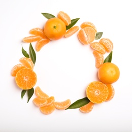 Composition with tangerines and leaves on white background, top view. Space for text