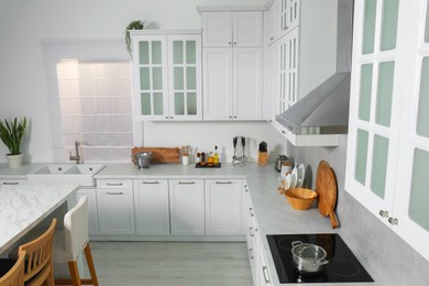 Photo of Beautiful kitchen interior with stylish modern furniture