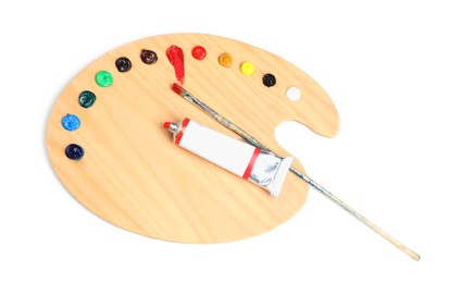 Palette with acrylic paints and brush on white background, top view. Artist equipment