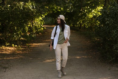 Photo of Beautiful woman in nature reserve on sunny day