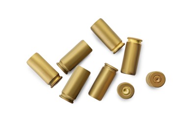 Shells of bullets on white background, top view