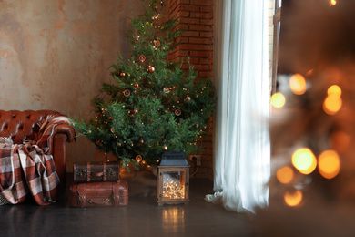 Photo of Beautiful living room interior with decorated Christmas tree and festive lights