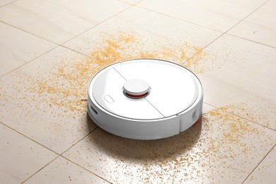 Robot vacuum cleaner removing dirt from floor in room