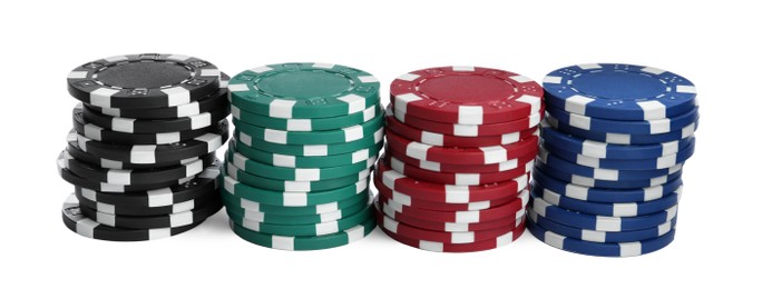 Plastic casino chips stacked on white background. Poker game