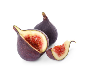 Whole and cut tasty fresh figs isolated on white