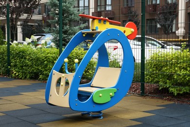 Photo of Empty spring rider on children's playground in residential area