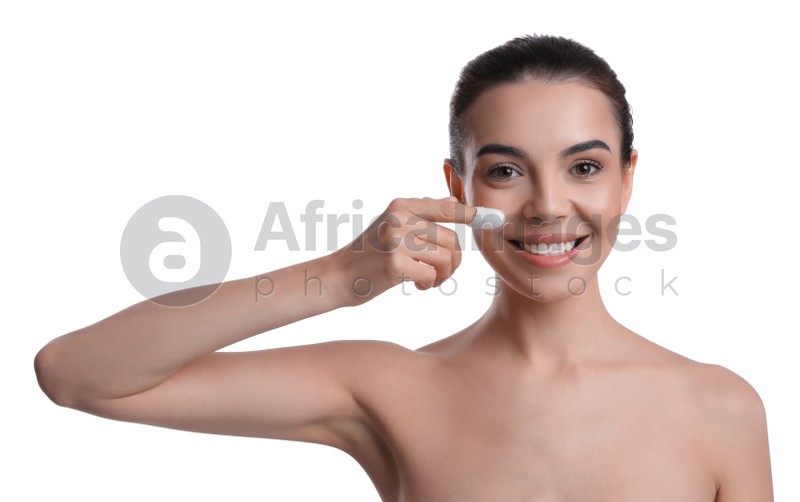 Woman using silkworm cocoon in skin care routine on white background