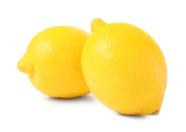 Two fresh ripe lemons isolated on white