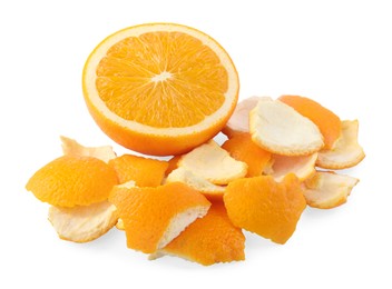 Photo of Orange peels preparing for drying and fresh fruit isolated on white