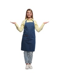 Beautiful young woman in denim apron on white background