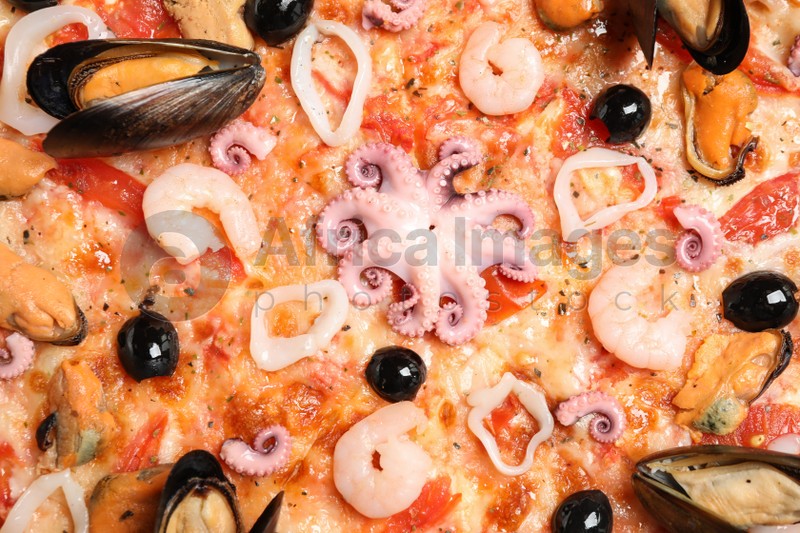 Delicious seafood pizza as background, closeup view