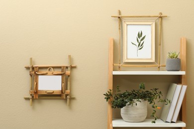 Photo of Bamboo frames and different decor elements indoors