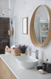 Mirror and counter with vessel sink in bathroom interior. Idea for design