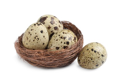 Nest with quail eggs on white background