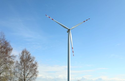 Modern wind turbines outdoors on sunny day. Alternative energy source