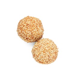 Photo of Delicious sesame balls on white background, top view