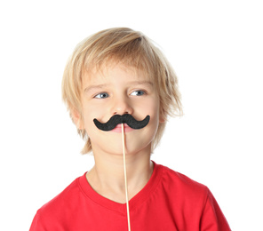 Photo of Little boy with fake mustache on white background. April fool's day