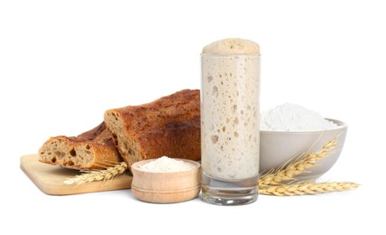 Photo of Freshly baked bread, sourdough, flour and spikes on white background