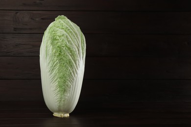 Fresh ripe Chinese cabbage on table against wooden background. Space for text
