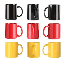 Set with different ceramic mugs on white background 