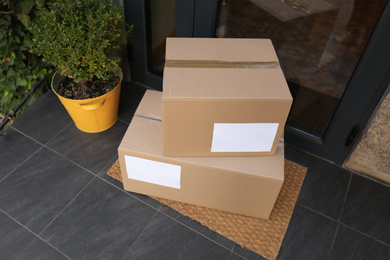 Delivered parcels on door mat near entrance, above view