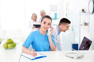 Young female receptionist working in hospital