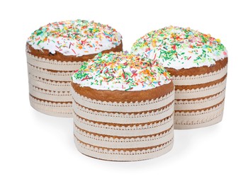 Photo of Traditional Easter cakes with sprinkles on white background