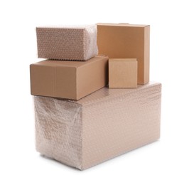 Cardboard boxes packed in bubble wrap and ordinary ones on white background