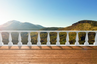 Image of Outdoor wooden terrace revealing picturesque view on mountains in morning