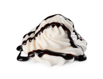 Delicious fresh whipped cream with chocolate syrup isolated on white