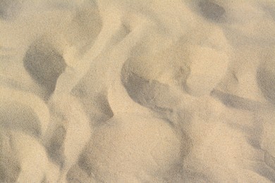 Photo of Dry beach sand as background, above view