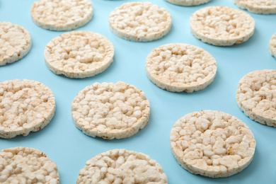 Puffed rice cakes on light blue background