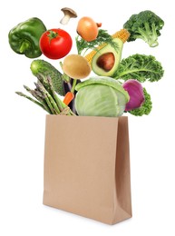 Paper bag with vegetables on white background. Vegetarian food 