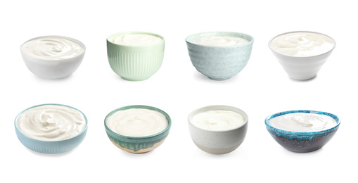 Set of delicious natural yogurt in bowls on white background. Banner design