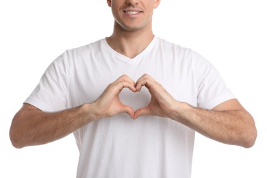 Man making heart with hands on white background, closeup