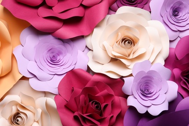 Photo of Different beautiful flowers made of paper as background, above view